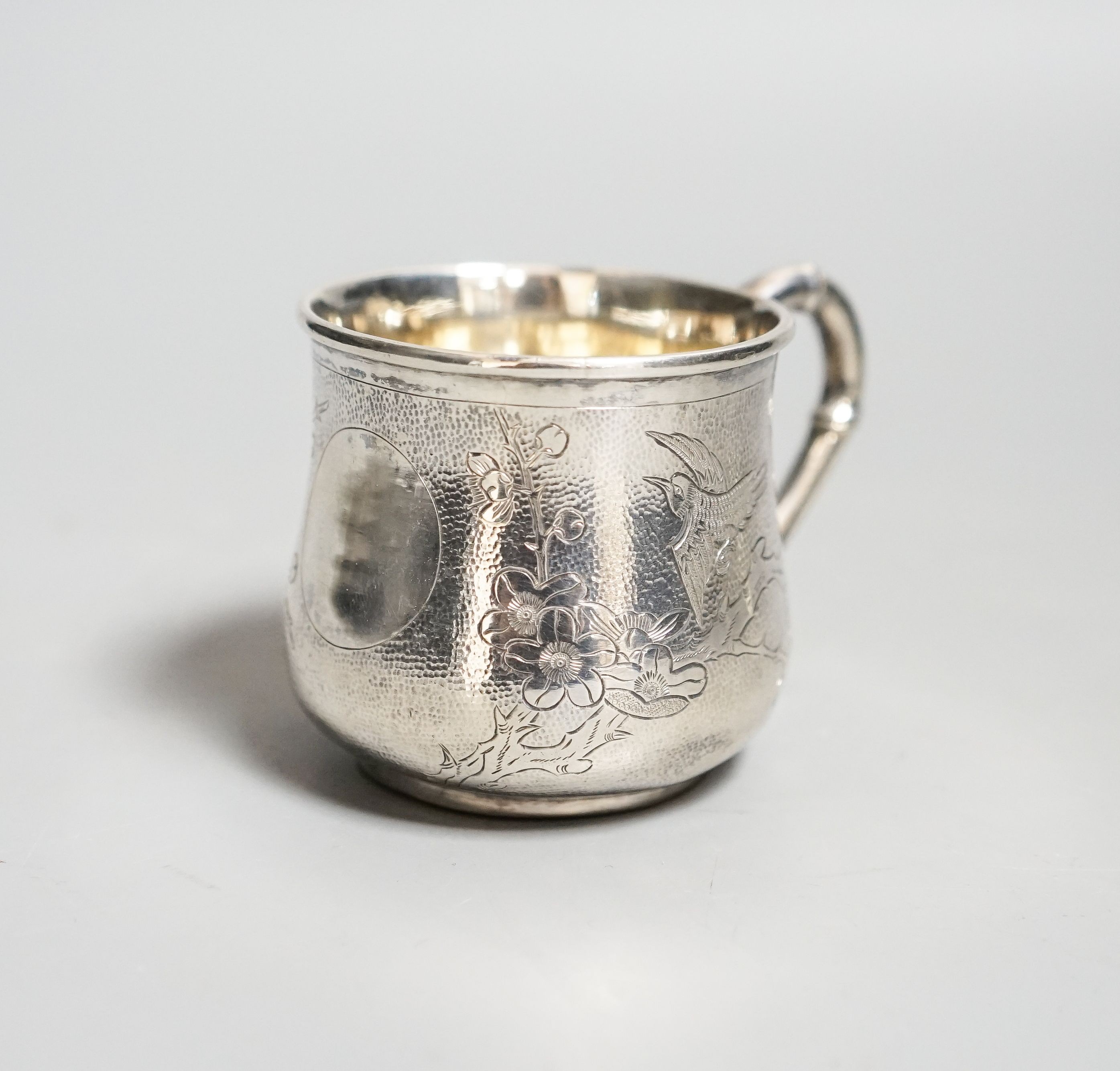 A Chinese white metal christening mug, by Zee Sung, 55mm.